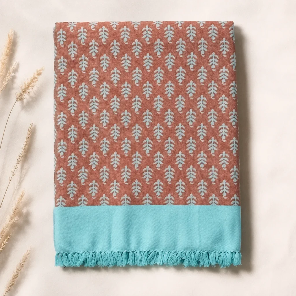 rust and turquoise leaf print cotton blanket