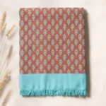 rust and turquoise leaf print cotton blanket