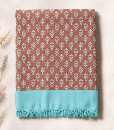 rust and turquoise leaf print cotton blanket