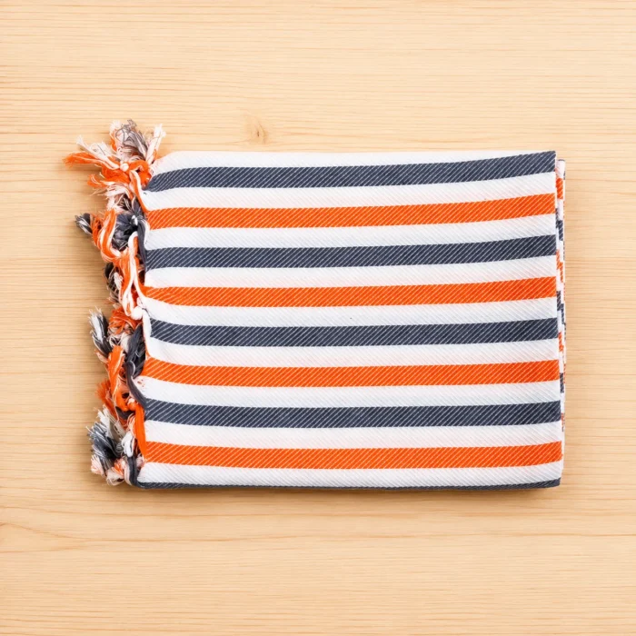 Premium orange and navy blue striped silk thread towel with fringed edge