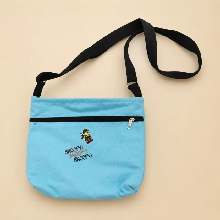 Premium blue cotton printed sling bag with adjustable black strap and zipper pocket